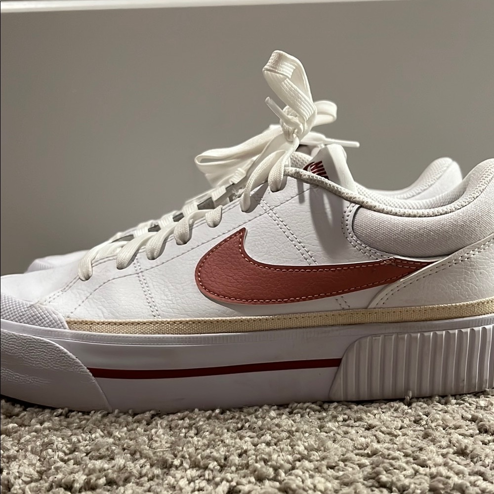 Nike White and Pink Sneakers with Classic Court Design